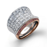 This dramatic white and rose gold ring features a stunning 4.38 ctw of princess cut white diamonds and .20 ctw of round cut pink diamonds in a gorgeous setting.