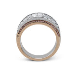 This dramatic white and rose gold ring features a stunning 4.38 ctw of princess cut white diamonds and .20 ctw of round cut pink diamonds in a gorgeous setting.