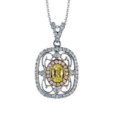 This lovely vintage inspired three-tone pendant features an intricate lacy design set with .38 ctw round cut white diamonds and .45 ctw yellow oval diamonds.