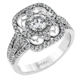 Reflecting an intricate vintage-inspired design, this three-tone gold ring is set with .61 ctw round cut white diamonds and a .53 ctw yellow oval diamond.