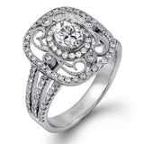 Reflecting an intricate vintage-inspired design, this three-tone gold ring is set with .61 ctw round cut white diamonds and a .53 ctw yellow oval diamond.