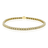 This brilliant yellow gold tennis-style classic bracelet is accentuated by the presence of 1.0 ctw of glistening round white diamonds.