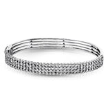 Three rows of 3.75 ctw of white diamonds make quite the statement in this 18k gold bangle bracelet.