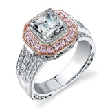 The dramatic contemporary design of this white gold ring is highlighted by .59 ctw of round cut white diamonds and .36 ctw princess cut diamonds.