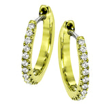 Featuring a classic hoop style with modern accents, these sparkling white gold earrings are accentuated by .17 ctw of round cut white diamonds.