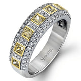 These stunning 18k white gold band contains .93 ctw of princess cut white diamonds as well as .44 ctw of round white diamonds.