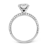 Presenting an eye-catching modern design, this white gold engagement ring and wedding band are highlighted by 1.45 ctw of round cut white diamonds.