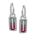 These stunning earrings feature cushion cut Aquamarines 1.53 ctw., surrounded by a halo of diamonds that dangle from diamond huggies 0.45 ctw