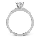 Featuring a dazzling contemporary design, this elegant white gold engagement ring and wedding band set is accented by .59 ctw of round cut white diamonds.