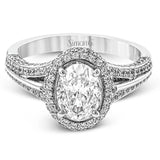 This lovely 18k white gold engagement ring design is created for an elegant oval center stone and features .77 ctw of white diamonds accented by a small touch of .03 ctw of yellow diamonds.