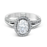 This lovely 18k white gold engagement ring design is created for an elegant oval center stone and features .77 ctw of white diamonds accented by a small touch of .03 ctw of yellow diamonds.