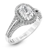 This lovely 18k white gold engagement ring design is created for an elegant oval center stone and features .77 ctw of white diamonds accented by a small touch of .03 ctw of yellow diamonds.