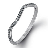 This dramatic white gold engagement ring and wedding band set are highlighted by .23 ctw of dazzling round cut white diamonds in a distinctive modern twist design.