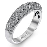 This lacy vintage inspired white gold band features .62 ctw of round cut white diamonds in a charming floral design.
