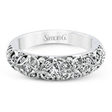 This lacy vintage inspired white gold band features .62 ctw of round cut white diamonds in a charming floral design.