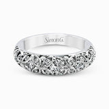 This lacy vintage inspired white gold band features .62 ctw of round cut white diamonds in a charming floral design.