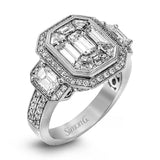 This brilliant white and rose gold contemporary ring is accentuated by a 2.0 ctw center mosaic of white diamonds, complemented by .30 ctw round cut white diamonds, .77 ctw emerald cut white diamonds, and .18 ctw round pink diamond accents.