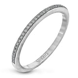 The elegant design of this classic white gold engagement ring and wedding band is complemented by .21 ctw of glimmering round cut white diamonds.