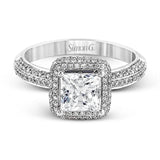 This vintage-inspired 18k white gold engagement ring is the perfect design for princess cut center stone because it has a detailed square shaped halo. The entire ring is set with .62 ctw of white diamonds.