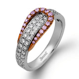 The eye-catching buckle design of this contemporary white and rose gold ring is highlighted by .65 ctw of round cut white diamonds.