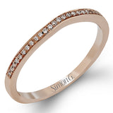 Featuring a simple, elegant classic design, this white gold engagement ring and wedding band is set with .16 ctw of round cut white diamonds.