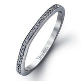 Featuring a simple, elegant classic design, this white gold engagement ring and wedding band is set with .16 ctw of round cut white diamonds.