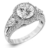 Reflecting a charming vintage design, this dazzling white gold engagement ring features .63 ctw of round cut white diamonds and .51 ctw of pear shaped white diamonds.