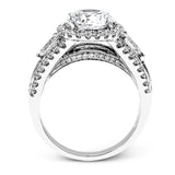 Reflecting a charming vintage design, this dazzling white gold engagement ring features .63 ctw of round cut white diamonds and .51 ctw of pear shaped white diamonds.