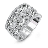 Delicate yet sophisticated, this stunning white gold ring is set with .75ctw round cut white diamonds highlighted by .27 ctw round cut white diamonds.