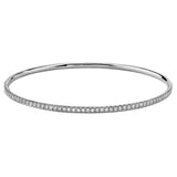 Simple but elegant, this classically styled white gold bangle bracelet is accentuated with .86 ctw of shimmering round white diamonds. Perfect for stacking.