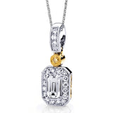 This impressive white and yellow gold classic pendant features an emerald cut ruby accented by .12ctw round white diamonds and a .02ct round cut yellow diamonds.