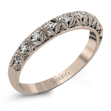 This intricate band has a floral, nature-inspired design and contains .32 ctw of white diamonds.