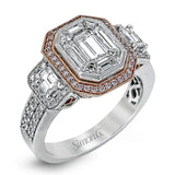 Featuring an eye-catching design, this stunning white and rose gold ring is highlighted by a 1.01 ctw center mosaic of white diamonds, accented by .28 ctw round white diamonds, .49 ctw emerald cut white diamonds, and .11 ctw round pink diamonds.
