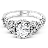 Reflecting an intricate modern design, this remarkable white gold ring is emphasized by a lovely halo complemented with .59 ctw round cut white diamonds.