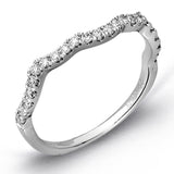 Reflecting an intricate modern design, this remarkable white gold ring is emphasized by a lovely halo complemented with .59 ctw round cut white diamonds.