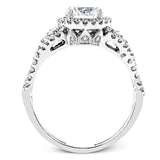 Reflecting an intricate modern design, this remarkable white gold ring is emphasized by a lovely halo complemented with .59 ctw round cut white diamonds.