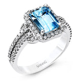 This elegant white gold contemporary ring is set with an arresting 1.31 ctw center aquamarine highlighted by .42 ctw round cut white diamond accents.