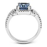 This elegant white gold contemporary ring is set with an arresting 1.31 ctw center aquamarine highlighted by .42 ctw round cut white diamond accents.
