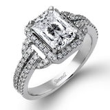 This elegant white gold contemporary ring is set with an arresting 1.31 ctw center aquamarine highlighted by .42 ctw round cut white diamond accents.