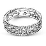This wonderful 18k gold band features .87 ctw of white diamonds set into an intricate, three layer design.  It can be worn on its own as a fashion statement or function as a wedding band.