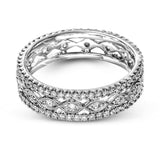 This wonderful 18k gold band features .87 ctw of white diamonds set into an intricate, three layer design.  It can be worn on its own as a fashion statement or function as a wedding band.