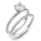 The classic, streamlined design of this 18k white gold wedding set is accented by .30 ctw of sparkling white round brilliant diamonds.