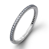 The classic, streamlined design of this 18k white gold wedding set is accented by .30 ctw of sparkling white round brilliant diamonds.