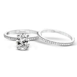 The classic, streamlined design of this 18k white gold wedding set is accented by .30 ctw of sparkling white round brilliant diamonds.