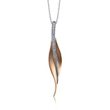 A sleek, svelte style highlights this modern leaf-like pendant, set with a column of .13 ctw of dazzling white diamonds.