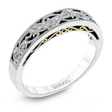Featuring a delicate, intricate vintage style, this white gold wedding band is set with .09 ctw of shimmering white diamonds.