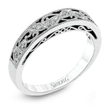 Featuring a delicate, intricate vintage style, this white gold wedding band is set with .09 ctw of shimmering white diamonds.