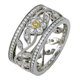 This charming white gold vintage style ring features a lovely floral design accented by .77 ctw of round cut white diamonds and .02 ctw round cut yellow diamonds.