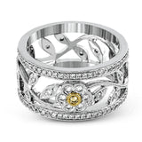 This charming white gold vintage style ring features a lovely floral design accented by .77 ctw of round cut white diamonds and .02 ctw round cut yellow diamonds.