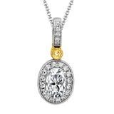 This dramatic classically styled two-tone pendant is features a .54 ctw oval cut ruby accentuated by .14 ctw round cut white diamonds and a .02 ctw round yellow diamond accent.